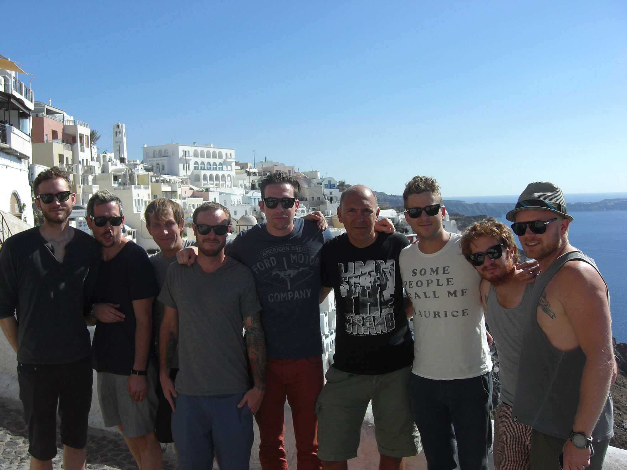 Artists on a break above the caldera in Oia, Santorini