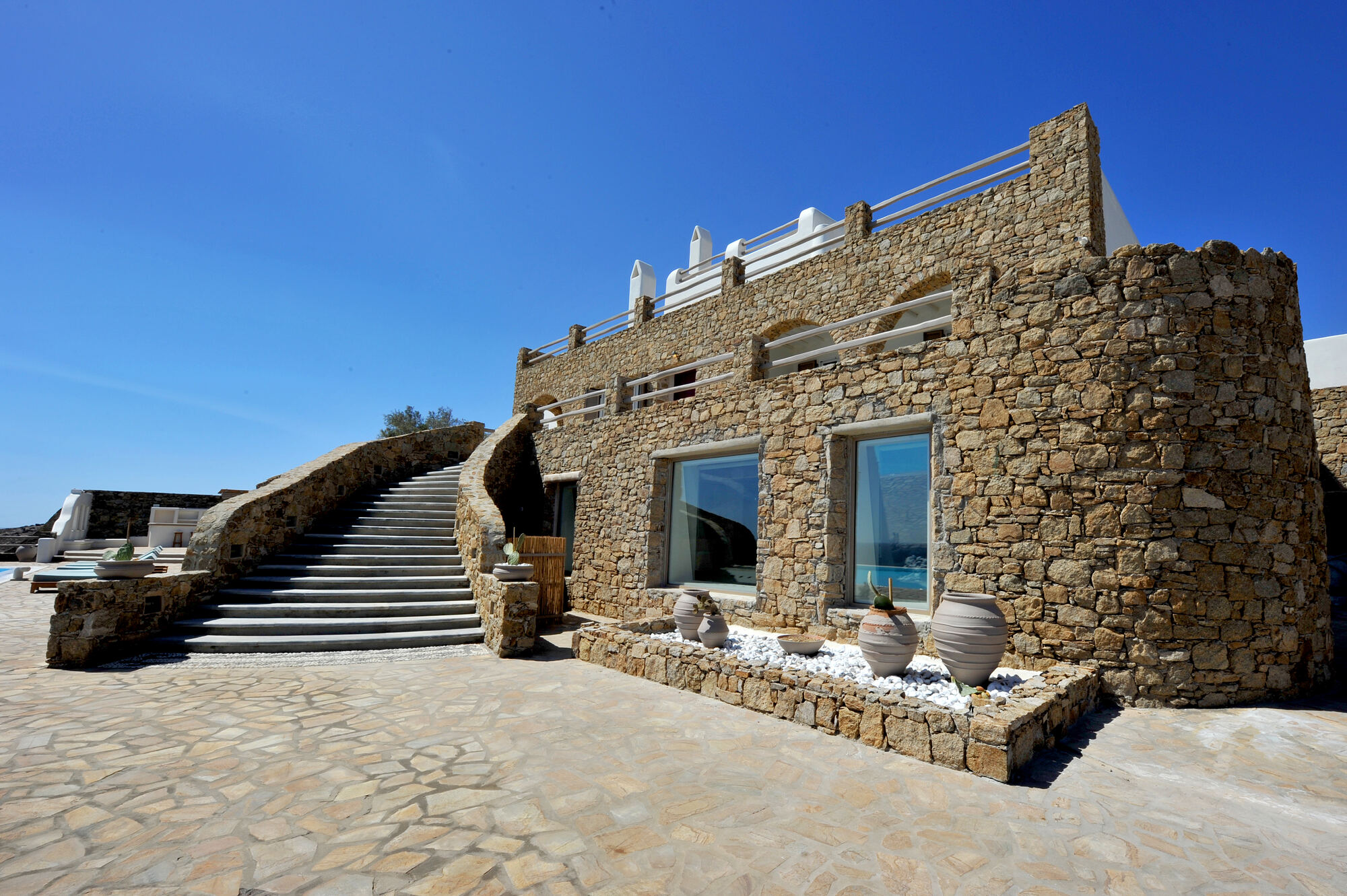 Stone steps up the side of the villa